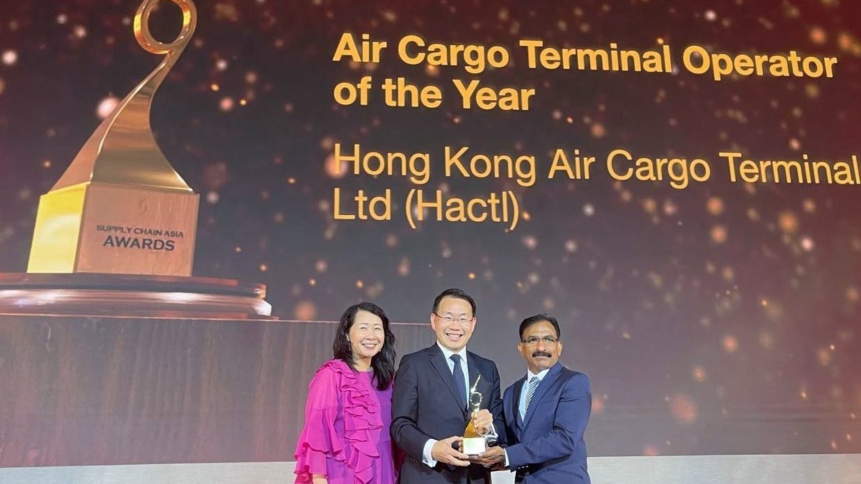Hactl Executive Director &ndash; Commercial and Business Development Joanna Li (left) and Hactl Chief Executive Wilson Kwong (middle) receive the &ldquo;Air Cargo Terminal Operation of the Year&rdquo;award.