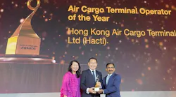 Hactl Executive Director – Commercial and Business Development Joanna Li (left) and Hactl Chief Executive Wilson Kwong (middle) receive the “Air Cargo Terminal Operation of the Year”award.