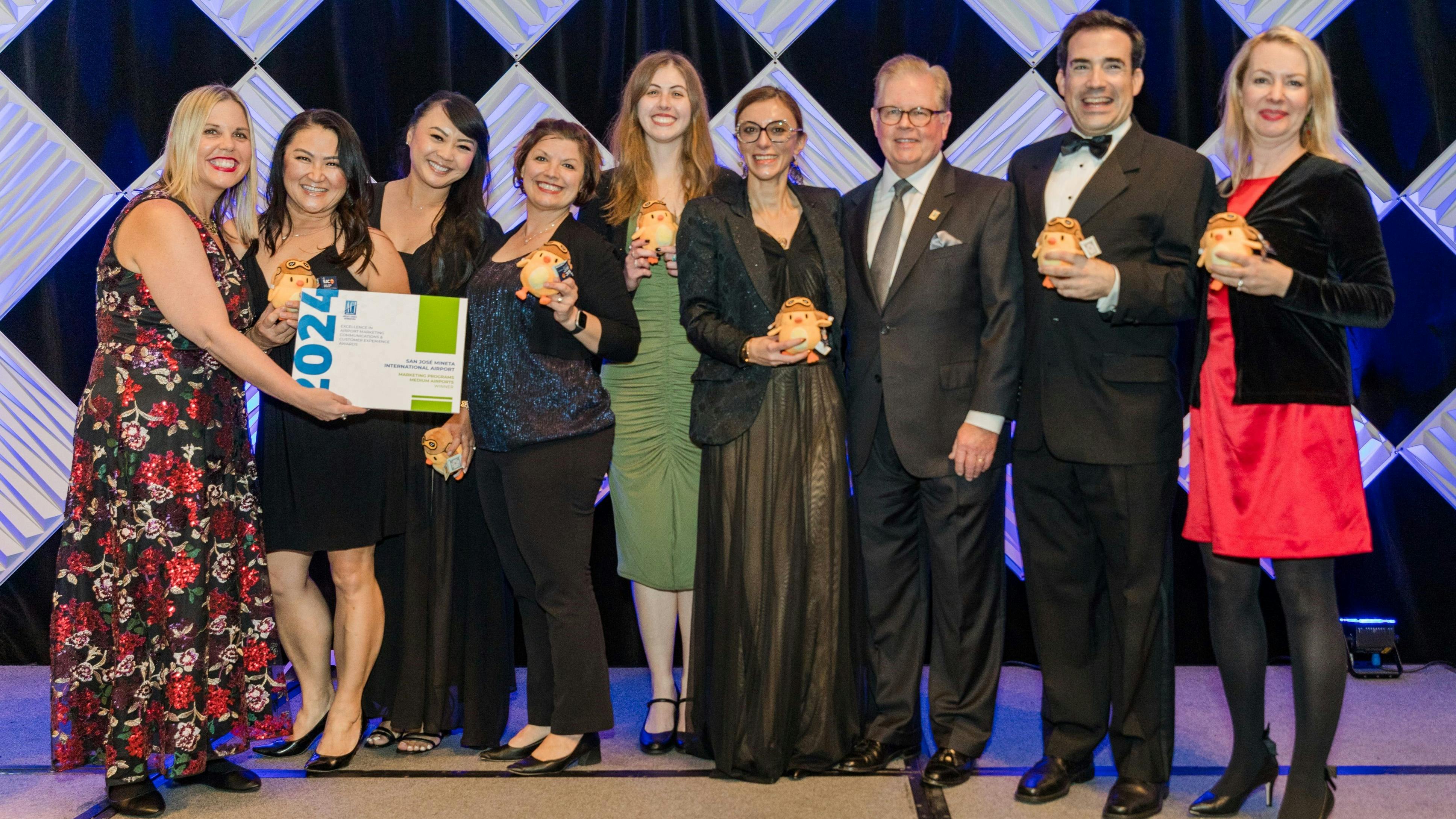 L-R: Heather Shelbrack, C.M., Chair, Marketing, Communications &amp; Customer Experience Steering Group, ACI-NA; Gina Robles, SJC; Monique Yamamoto, SJC; Jill Stone, SJC; Kayla Renelle, SJC; Ana Maria State, SJC; Kevin M. Burke, President and Chief Executive Officer, ACI-NA; Scott Wintner, SJC; Julie Jarratt, SJC