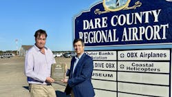 67c74e69616e31395dc6ca93 Ambrose Left Receives Plaque From Dean Right 22620