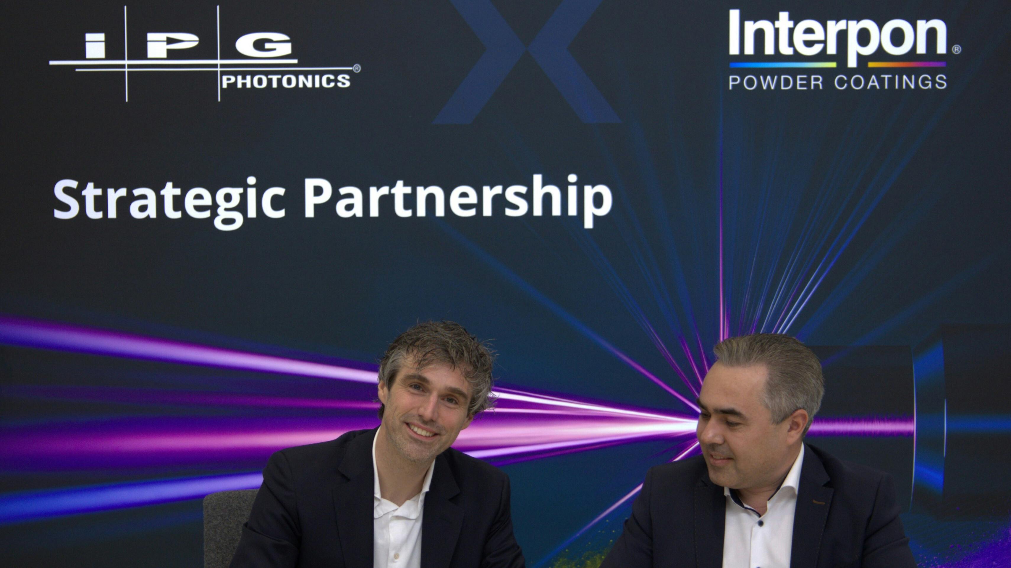 Pictured at the official signing ceremony to finalize the partnership are Jorrit van Rijn, Marketing Director of AkzoNobel&rsquo;s Powder Coatings business (left) and Andrey Mashkin, VP of Operations Europe and Managing Director of IPG Photonics (right).