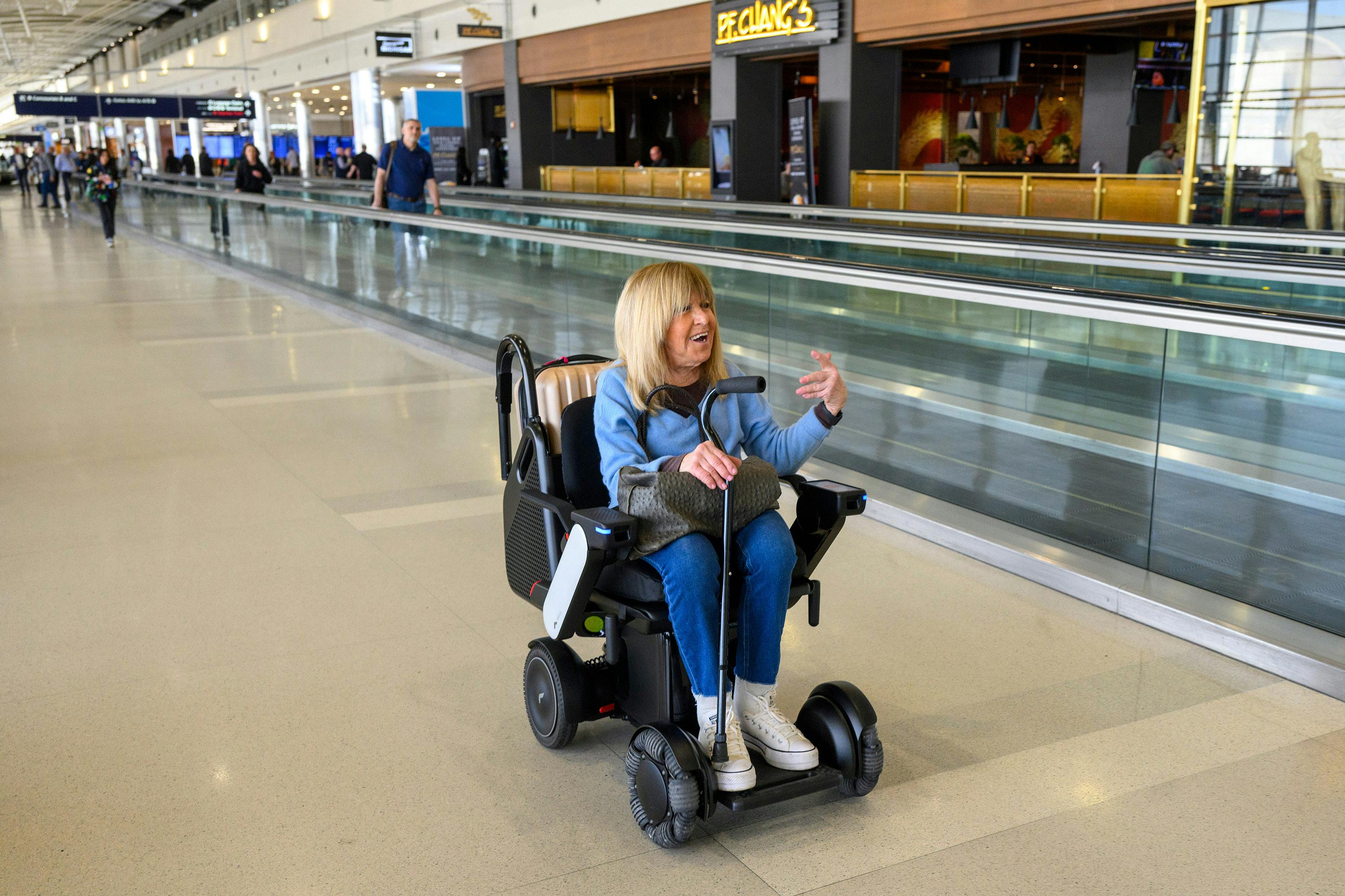 Marlene Gelfand rides in an autonomous wheelchair at McNamara Terminal at Detroit Metropolitan Airport on April 14, 2025, in Detroit. The Bloomfield Hills, Michigan, woman was traveling to Fort Lauderdale, Florida, and was trying out the new service at the airport.