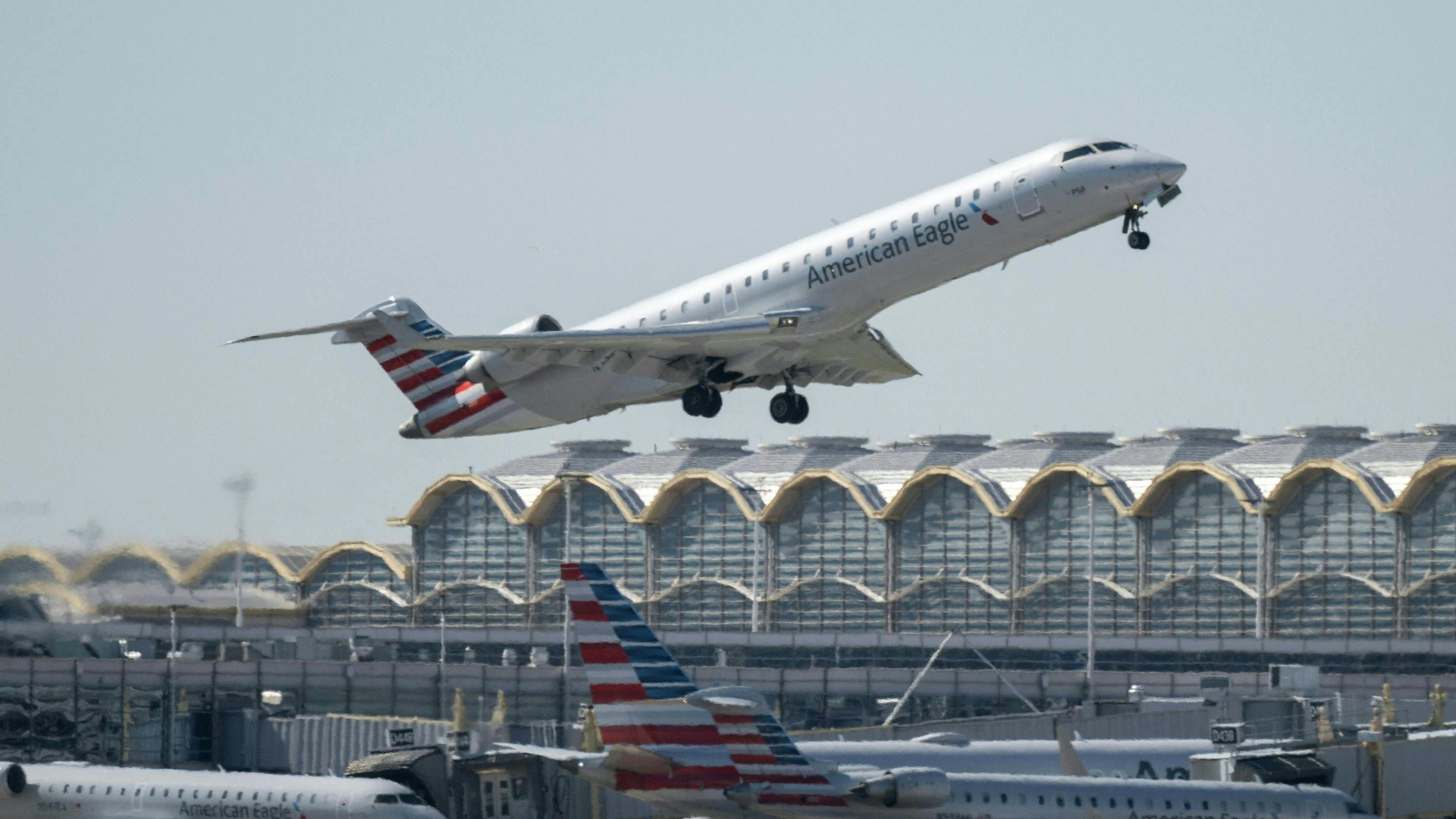 A regional American Airlines plane takes off from Ronald Reagan Washington National Airport in Arlington, Virginia on March 20, 2023.