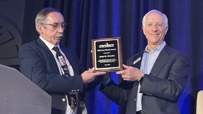 Jerry Crowley, right, receives the Leo Weston Award from Marshall Filler during ARSA&rsquo;s 2025 Annual Conference.