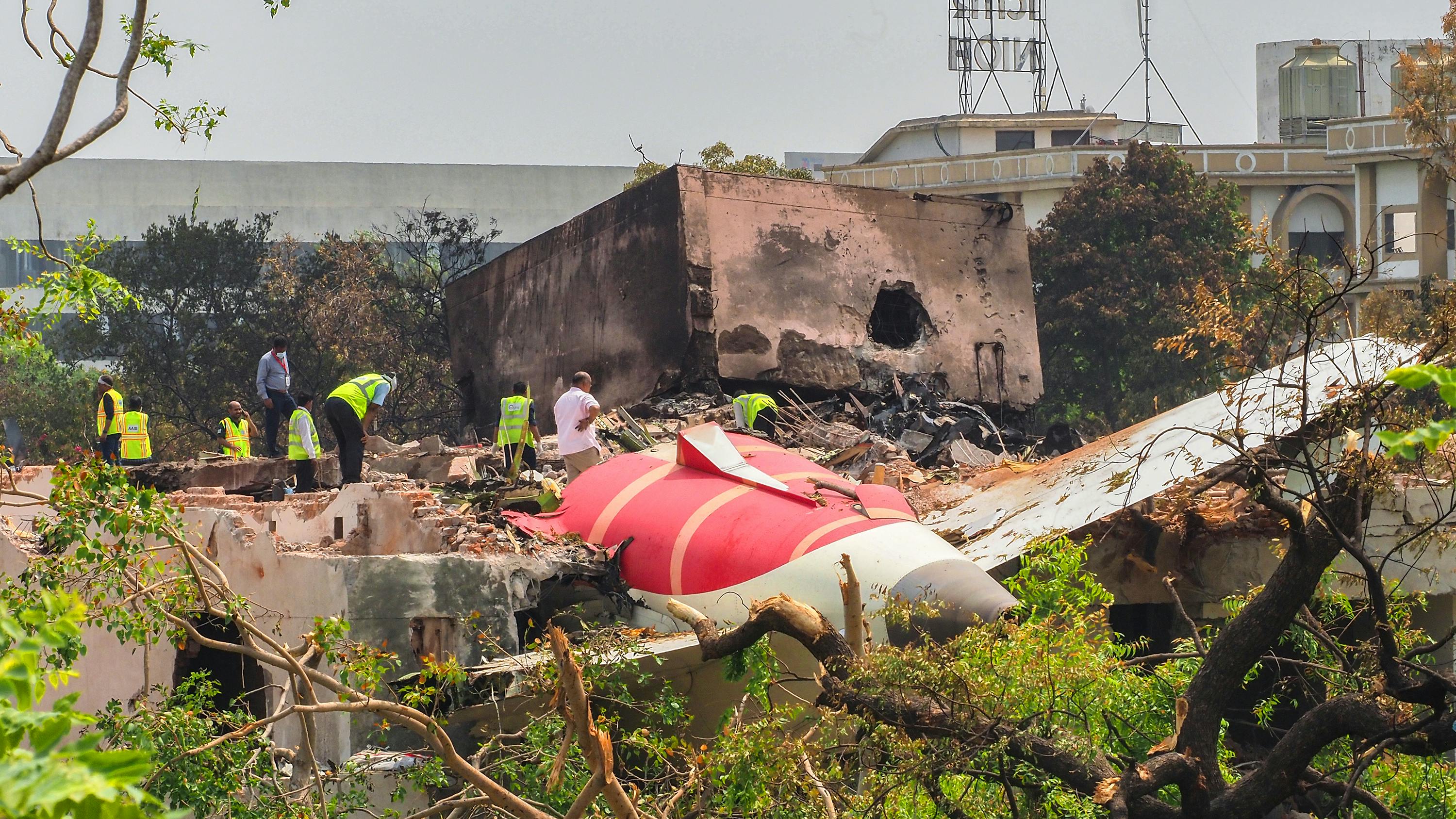An investigation team inspects the wreckage of Air India flight 171 a day after it crashed in a residential area near the airport, in Ahmedabad on June 13, 2025. Investigators recovered a black box recorder from the crash site on June 13 of a London-bound passenger jet that plowed into a residential area of India's Ahmedabad city, killing at least 265 people on board and on the ground. (Sam Panthaky/AFP/Getty Images/TNS)