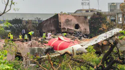 An investigation team inspects the wreckage of Air India flight 171 a day after it crashed in a residential area near the airport, in Ahmedabad on June 13, 2025. Investigators recovered a black box recorder from the crash site on June 13 of a London-bound passenger jet that plowed into a residential area of India's Ahmedabad city, killing at least 265 people on board and on the ground. (Sam Panthaky/AFP/Getty Images/TNS)