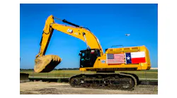mckinney_mayor_bill_cox_drops_dirt_from_an_excavat