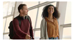 Passengers move effortlessly through the terminal, reflecting the growing adoption of on-the-move biometric screening at major U.S. airports like MCO and LAX.