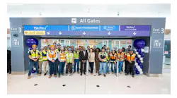 Officials and construction crew gather to celebrate the opening of DEN’s East Security Checkpoint on August 4.