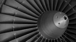 A close-up shot shows an aircraft engine's turbine