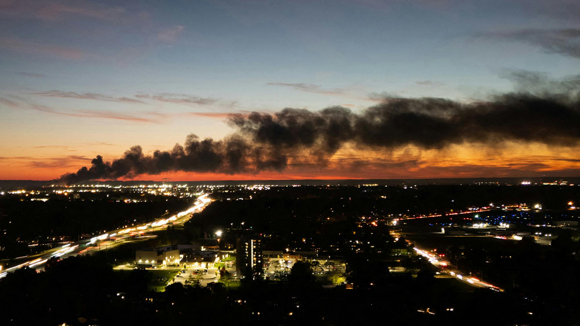 Smoke rises from the site of a UPS cargo plane crash near the UPS Worldport at Louisville Muhammad Ali International Airport in Louisville, Kentucky, on Nov. 4, 2025. (Leandro Lozada/AFP/Getty Images/TNS)