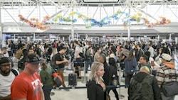 Travelers wait in line at a security checkpoint at George Bush Intercontinental Airport in Houston, Texas on Nov. 7, 2025. Hundreds of flights were canceled across the United States on Friday after the Trump administration ordered reductions to ease strain on air traffic controllers who are working without pay amid congressional paralysis on funding the U.S. budget. (Ronaldo Schemidt/AFP/Getty Images/TNS) Travelers wait in line at a security checkpoint at George Bush Intercontinental Airport in Houston, Texas on Nov. 7, 2025. Hundreds of flights were canceled across the United States on Friday after the Trump administration ordered reductions to ease strain on air traffic controllers who are working without pay amid congressional paralysis on funding the U.S. budget. (Ronaldo Schemidt/AFP/Getty Images/TNS)