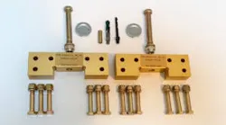 A collection of brass-colored landing gear parts, including screws and drill bits, against a white background