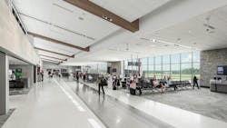 Asheville Regional Airport’s recent terminal expansion embraced local culture, resulting in a facility that distinctly reflects western North Carolina. The new concourse incorporates natural materials like wood and stone, mountain-inspired architectural lines, and artistic metalwork, all bathed in natural light with panoramic views. The airport now features a blend of local and national dining options, expanded restrooms modeled for both comfort and durability, and larger seating areas that offer a greater variety of seating choices shaped by traveler feedback. Asheville Regional Airport’s recent terminal expansion embraced local culture, resulting in a facility that distinctly reflects western North Carolina. The new concourse incorporates natural materials like wood and stone, mountain-inspired architectural lines, and artistic metalwork, all bathed in natural light with panoramic views. The airport now features a blend of local and national dining options, expanded restrooms modeled for both comfort and durability, and larger seating areas that offer a greater variety of seating choices shaped by traveler feedback.
