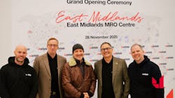 Five people stand smiling in front of a sign that reads, 'East MIdlands MRO Centre' Five people stand smiling in front of a sign that reads, 'East MIdlands MRO Centre'