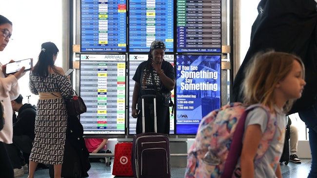 EL SEGUNDO, CA, NOVEMBER 7, 2025: Marsha Taulton, center, has an on-time flight home to Houston at LAX on Friday, November 7, 2025. (Christina House / Los Angeles Times)
