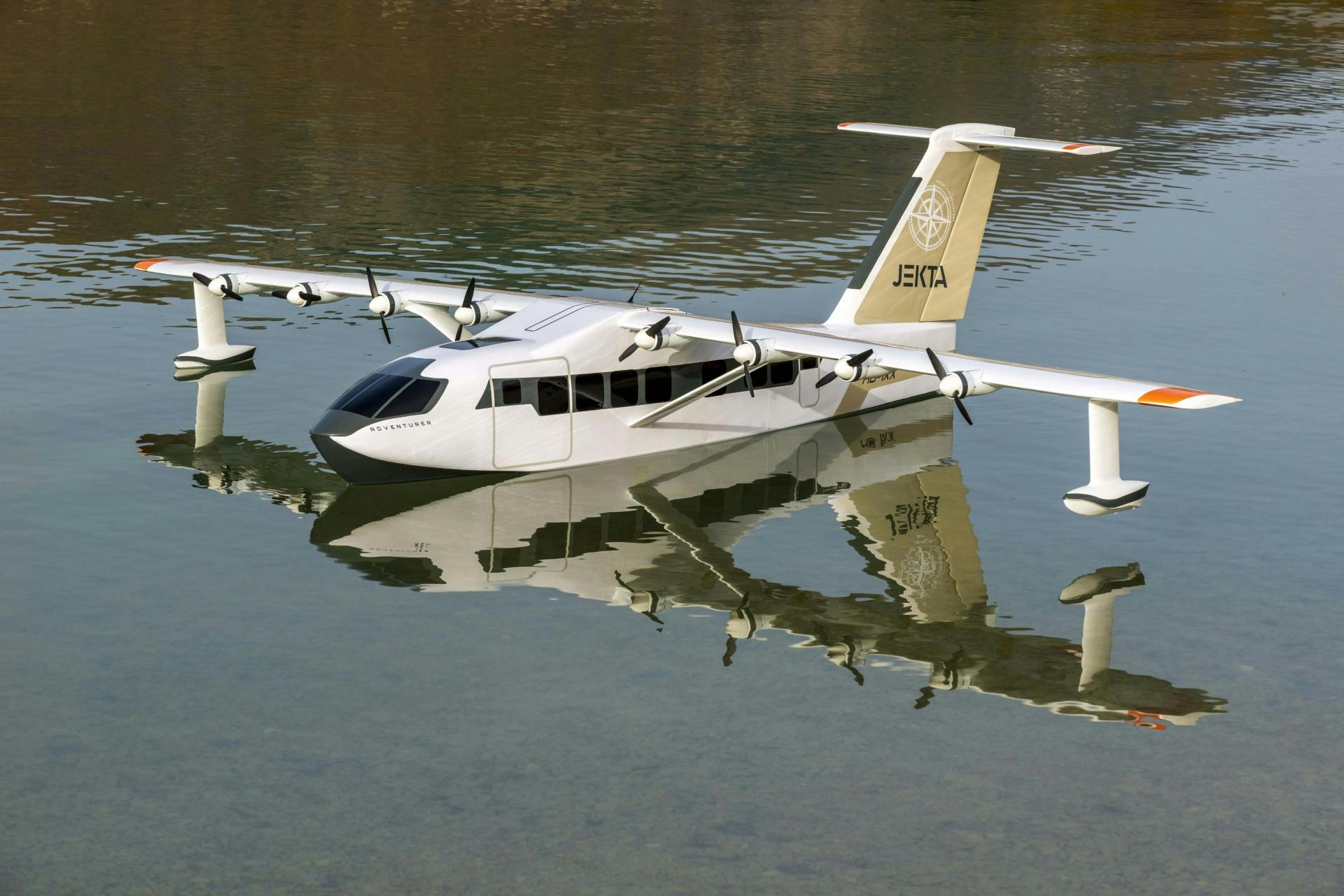 A white airplane floating on a body of water