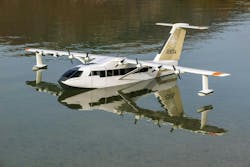 A white airplane floating on a body of water A white airplane floating on a body of water