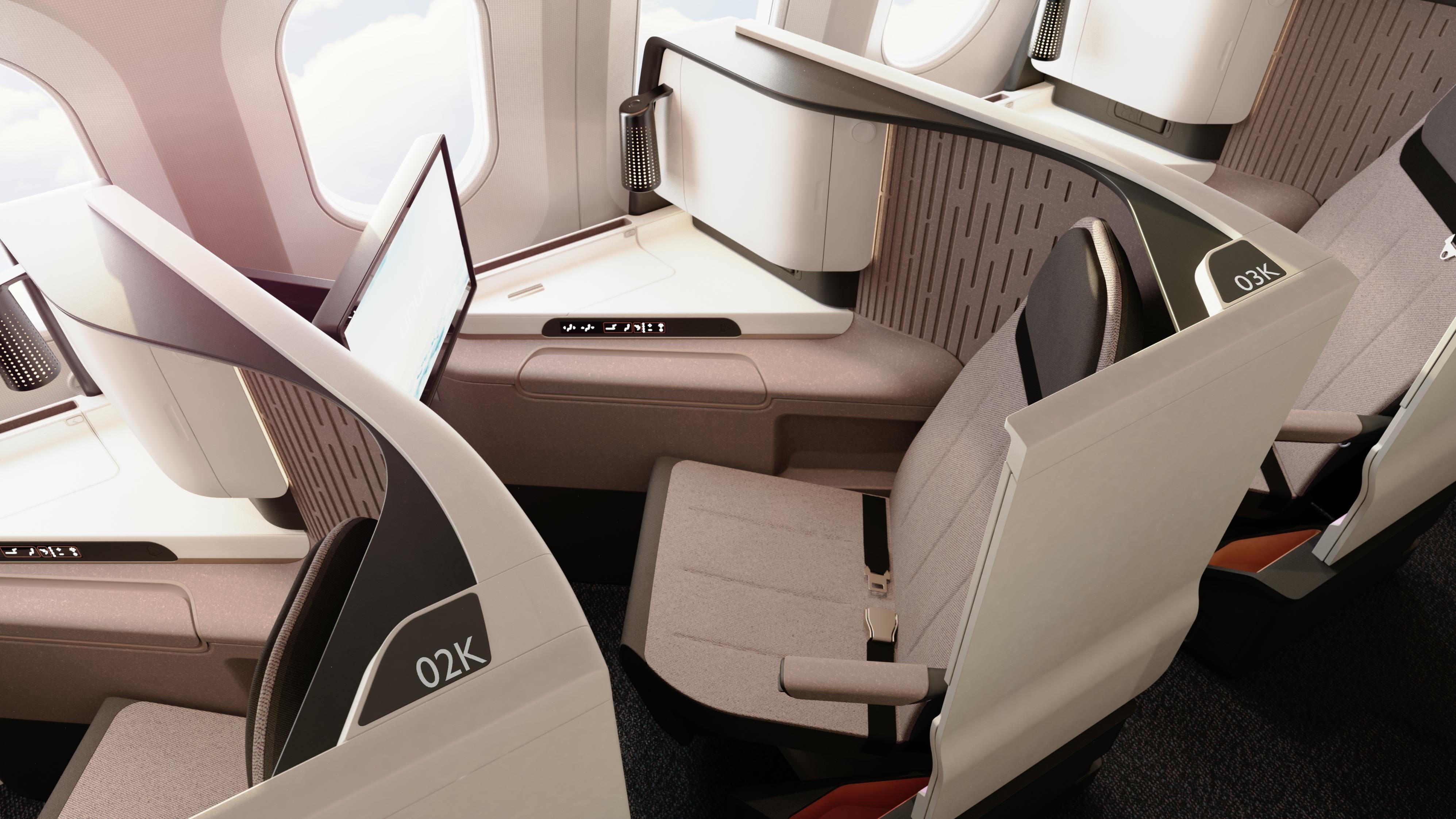 A row of premium-class aircraft seats that feature seating, monitors, dividers, tables, and windows