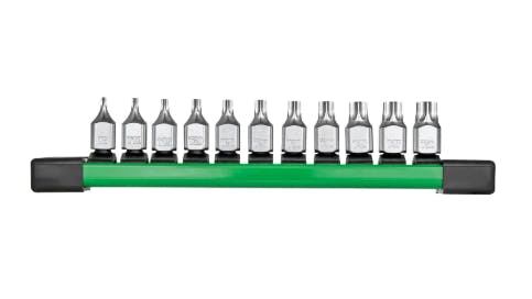 A line of 11 metal bit sockets sits on a green platform.