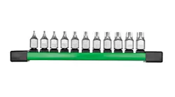 A line of 11 metal bit sockets sits on a green platform.