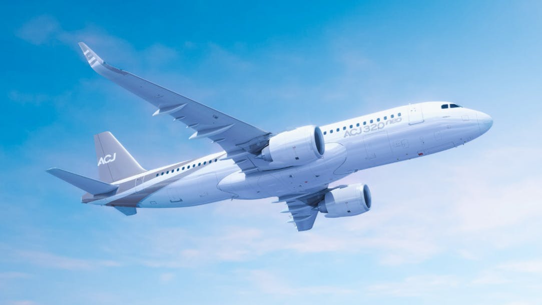 A white airplane with text on it that reads, 'ACJ320neo' flies in a blue sky