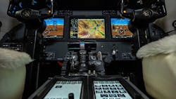 A flight deck with black hardware and an array of buttons and screens A flight deck with black hardware and an array of buttons and screens