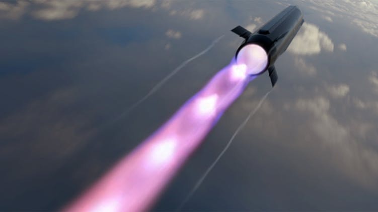A black missile flying through a dark sky with a purple trail of light behind it