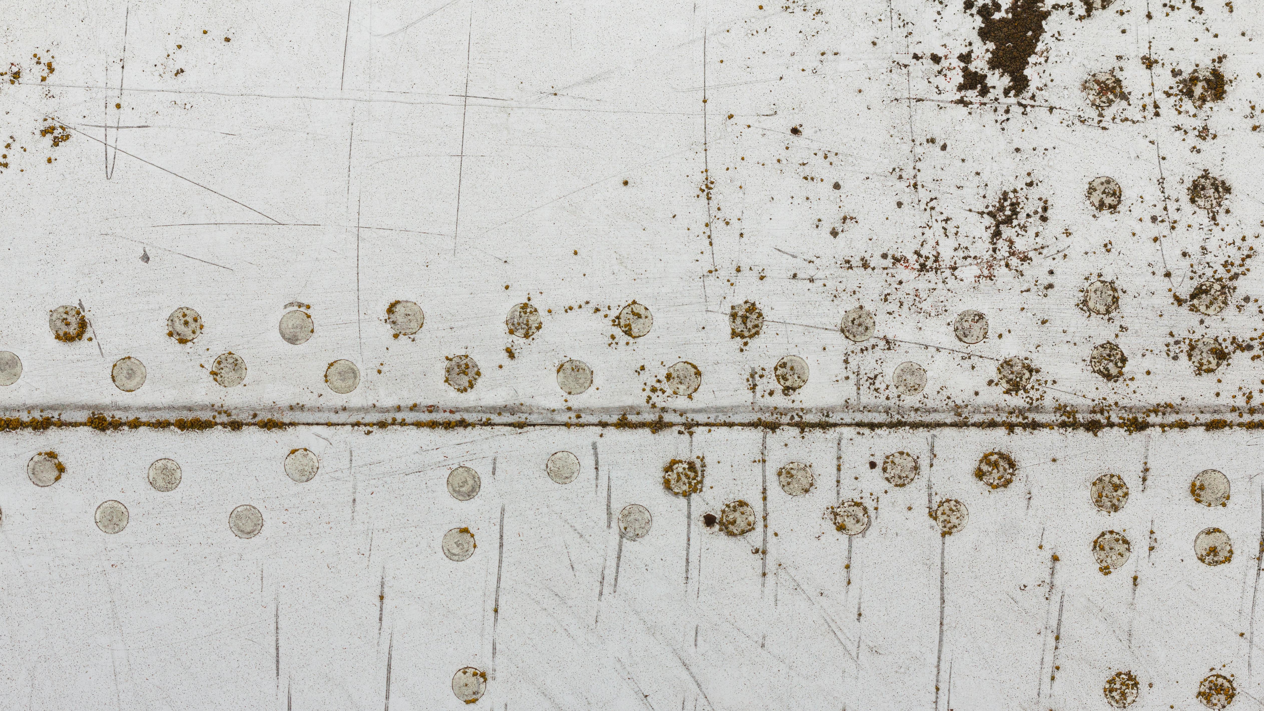 The side panels of an airplane showing corrosion and rust