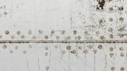 The side panels of an airplane showing corrosion and rust The side panels of an airplane showing corrosion and rust