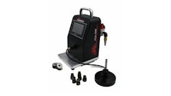 A black air gage with a screen, a metal handle and several attachments sitting in front of it A black air gage with a screen, a metal handle and several attachments sitting in front of it