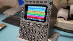 A tool with a screen and keyboard that displays repeating text that reads: AMETEK-MUIRHEAD-AVIONICS A tool with a screen and keyboard that displays repeating text that reads: AMETEK-MUIRHEAD-AVIONICS