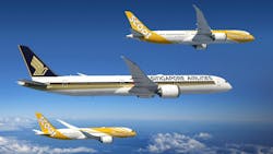 Three airplanes in the sky decorated in white, black, and yellow livery with one plane showing the text, 'Singapore Airlines' and the other two showing the text, 'SCOOT' Three airplanes in the sky decorated in white, black, and yellow livery with one plane showing the text, 'Singapore Airlines' and the other two showing the text, 'SCOOT'