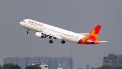 A white airplane with a red and orange tail with text on the side that reads: Sun PhuQuoc Airways A white airplane with a red and orange tail with text on the side that reads: Sun PhuQuoc Airways