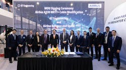 A large group of professionals wearing suits standing behind a table and in front of a backdrop that reads: MOU Signing Ceremony Airbus A330 MRTT+ Cabin Modification ST Engineering and Airbus Defence and Space A large group of professionals wearing suits standing behind a table and in front of a backdrop that reads: MOU Signing Ceremony Airbus A330 MRTT+ Cabin Modification ST Engineering and Airbus Defence and Space
