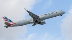 A white airplane with red and blue accents on the tail and the word 'American' printed on the side A white airplane with red and blue accents on the tail and the word 'American' printed on the side