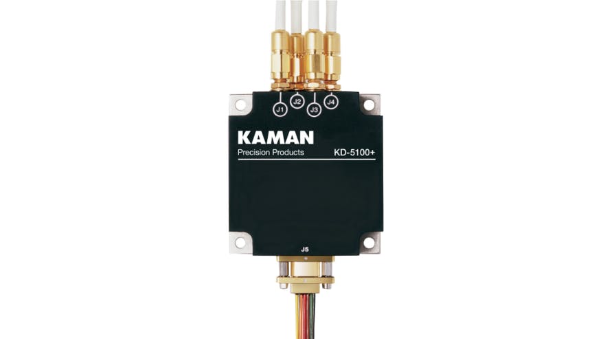 A black and brass piece of equipment with 'KAMAN Precision Products' printedon it