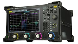 A large black piece of equipment with a screen showing a line graph and various knobs and buttons A large black piece of equipment with a screen showing a line graph and various knobs and buttons