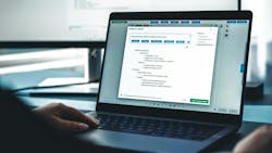 A laptop on a desk with 'Amelia Co-Author' at the top of the page on the screen A laptop on a desk with 'Amelia Co-Author' at the top of the page on the screen