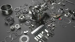 An array of metal airplane parts scattered on a gray surface An array of metal airplane parts scattered on a gray surface