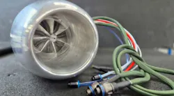 A close-up shot of an engine with cables sticking out of it