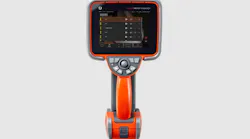 An orange borescope device with silver buttons and a black screen