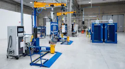 The floor of a repair shop, featuring rows of heavy machinery The floor of a repair shop, featuring rows of heavy machinery