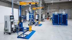 The floor of a repair shop, featuring rows of heavy machinery The floor of a repair shop, featuring rows of heavy machinery