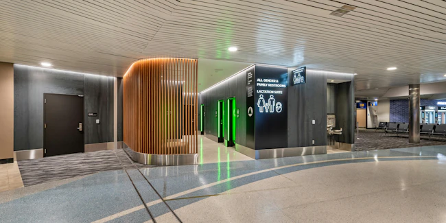 Renovated restroom facilities at Oakland International Airport reflect a hospitality-inspired approach to passenger experience and design.