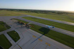An airplane taxis along the revamped runway. An airplane taxis along the revamped runway.