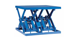 A blue metal scissor lift with hydraulics A blue metal scissor lift with hydraulics