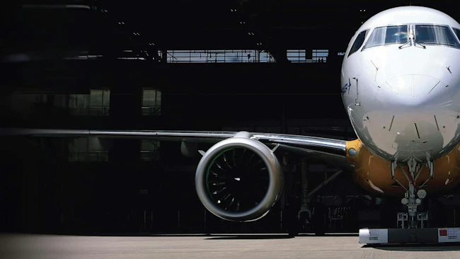 A photograph of a parked airplane, focusing on the engine