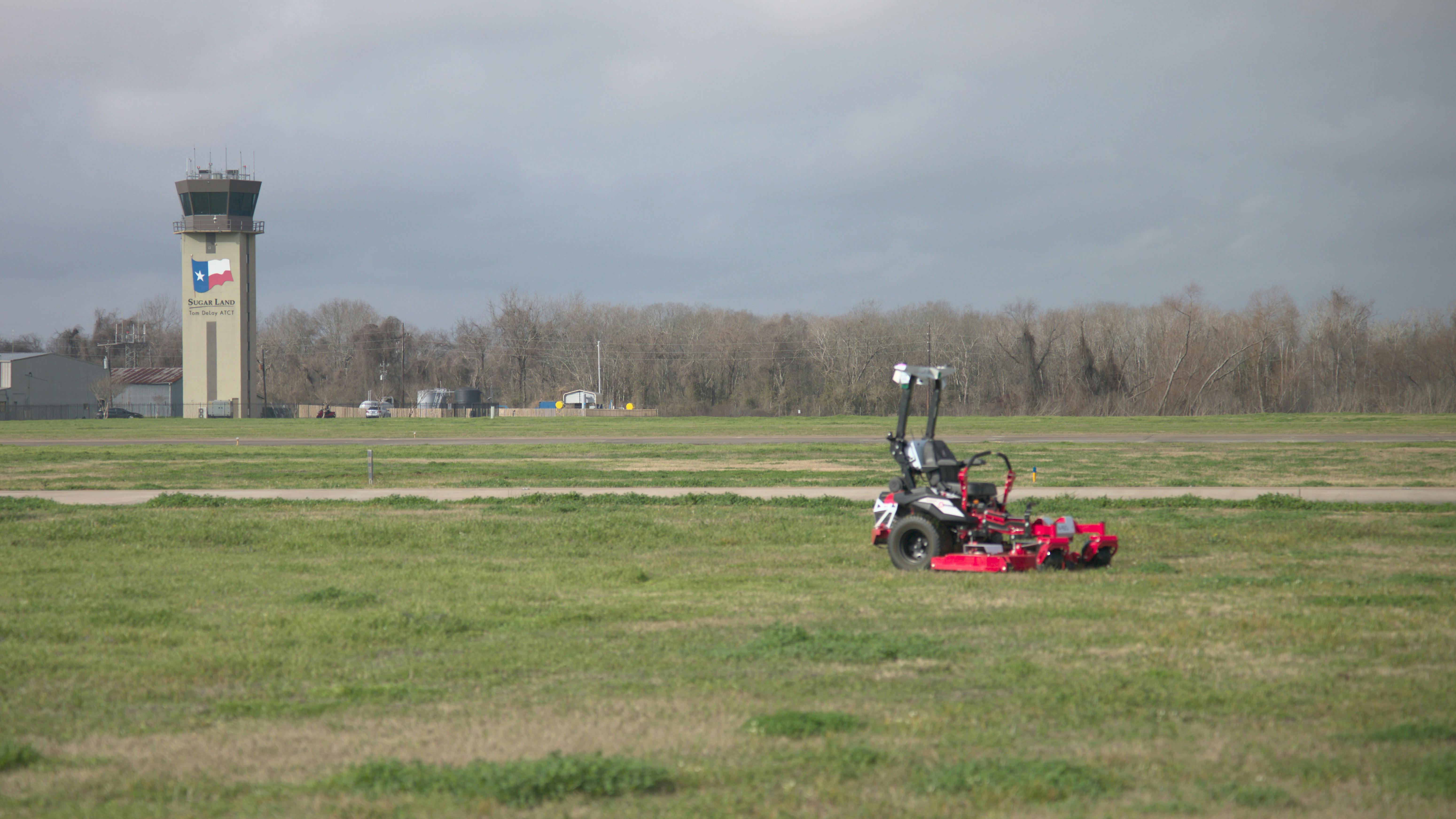 Autonomous mowers operate within geofenced zones on the airfield, allowing maintenance teams to maintain turf while crews are deployed to higher-priority runway and infrastructure work.