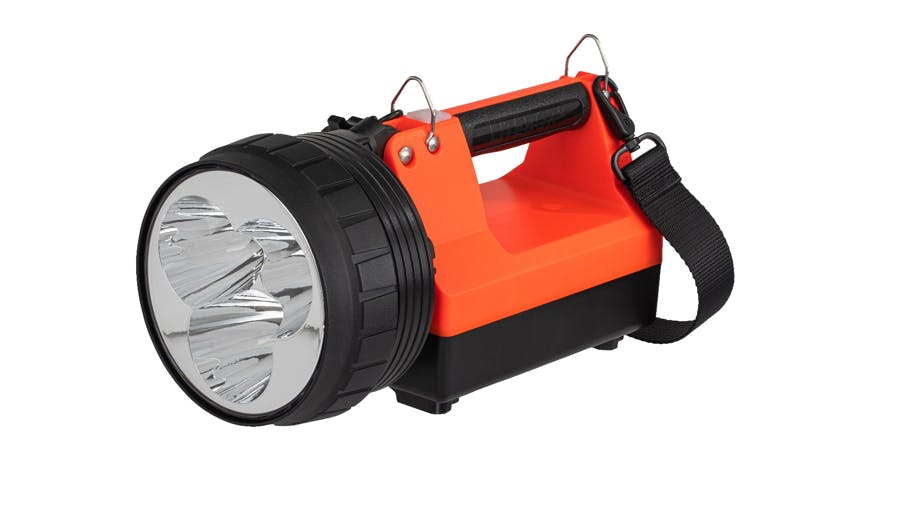 A heavy-duty flashlight with a large bulb and a red body and handle and black base